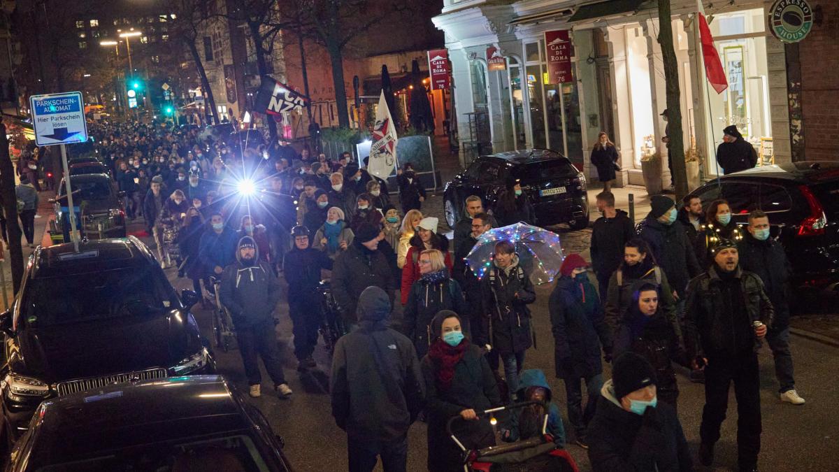 Anti-vaccination protesters roam the streets of Hamburg in their thousands despite the ban